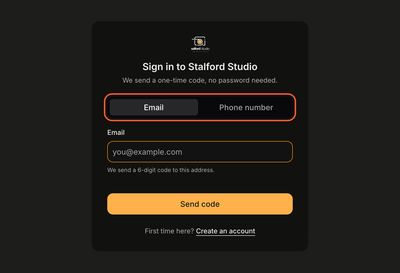 The portal sign-in card in dark mode for an organization with SMS sign-in on: the logo, Sign in to Stalford Studio, We send a one-time code, no password needed, a highlighted switch between Email and Phone number, an Email field with the hint We send a 6-digit code to this address, a Send code button, and First time here? Create an account