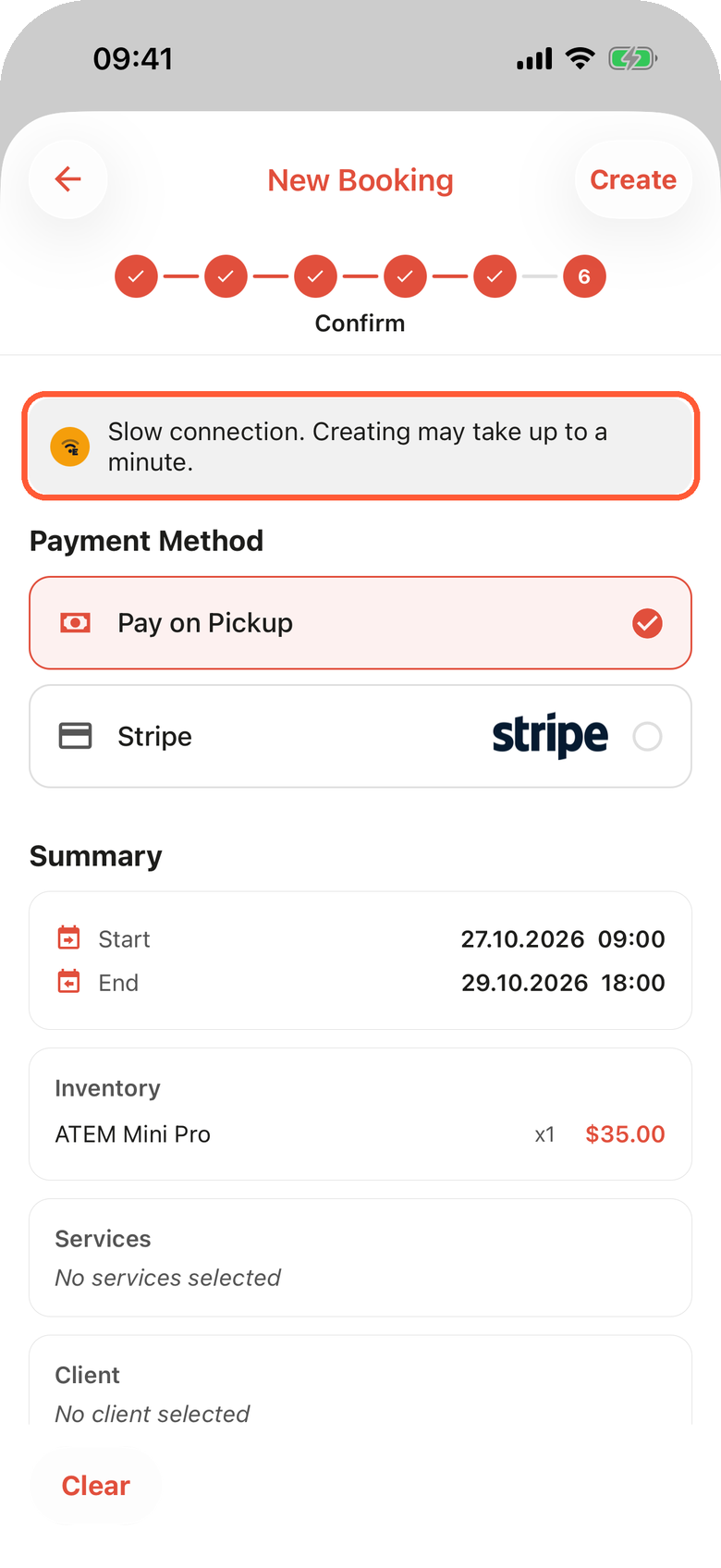 The Confirm step of a new booking on an iPhone with the highlighted notice Slow connection. Creating may take up to a minute, above Payment Method with Pay on Pickup selected and the Summary with dates and items