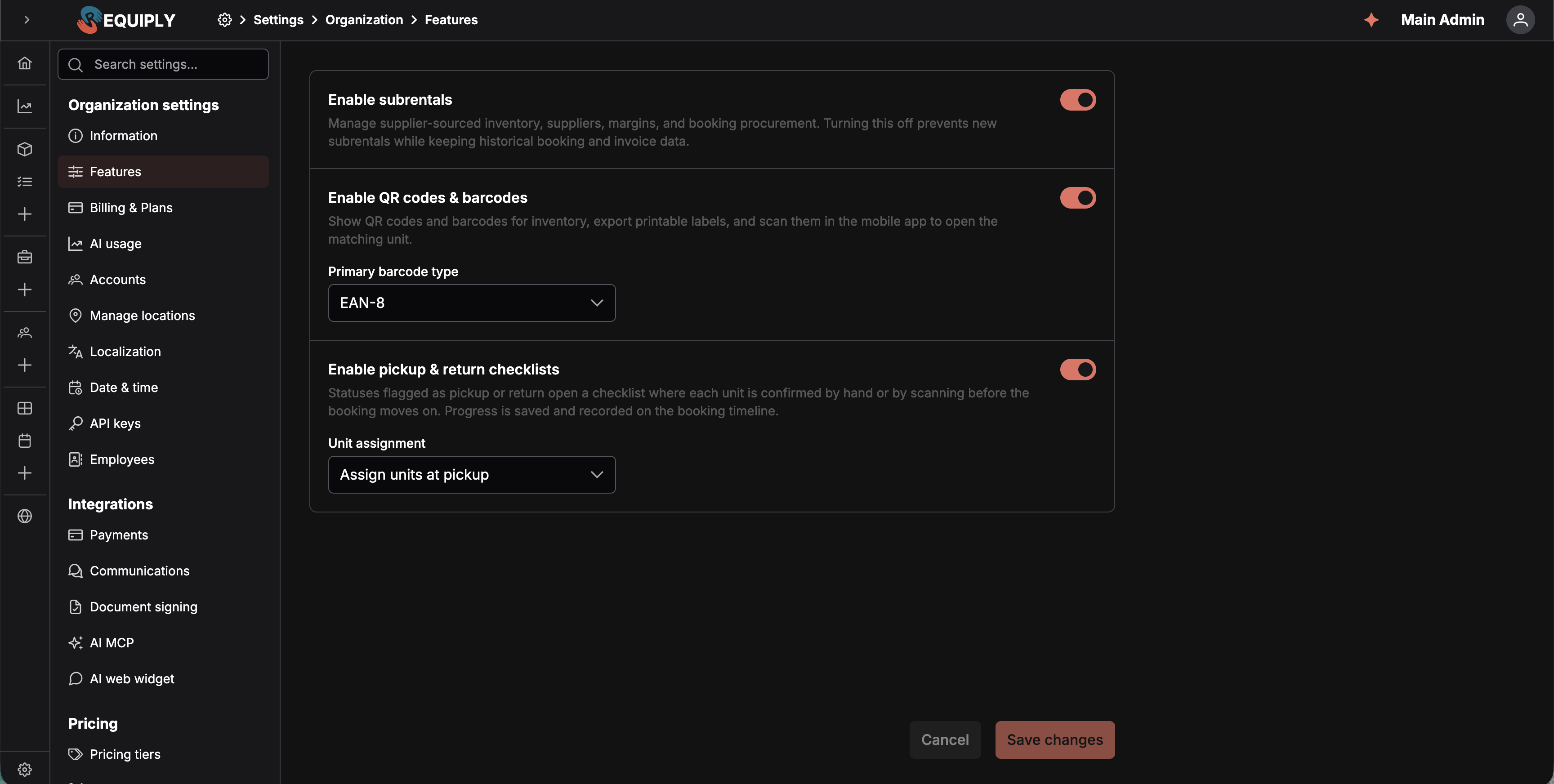 La página Features con tres filas, Enable subrentals, Enable QR codes and barcodes y Enable pickup and return checklists, cada una con una descripción y un interruptor, todas activadas; la fila de códigos de barras tiene un desplegable Primary barcode type con EAN-8 y la fila de las listas de comprobación un desplegable Unit assignment con Assign units at pickup